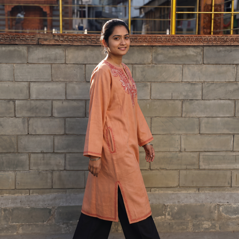 Peach Sozni Hand Embroidered Kashmiri Merino Wool Pheran, worn by a model, AI visual of the pheran, iTokri