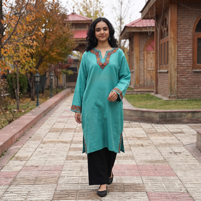 Green Sozni Hand Embroidered Kashmiri Merino Wool Pheran, worn by a model, AI visual of the pheran, iTokri