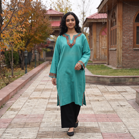 Green Sozni Hand Embroidered Kashmiri Merino Wool Pheran, worn by a model, AI visual of the pheran, iTokri