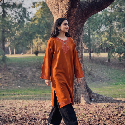 Red Sozni Hand Embroidered Kashmiri Merino Wool Pheran, worn by a model, AI visual of the pheran, iTokri