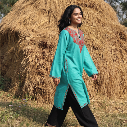 Green Sozni Hand Embroidered Kashmiri Merino Wool Pheran, worn by a model, AI visual of the pheran, iTokri