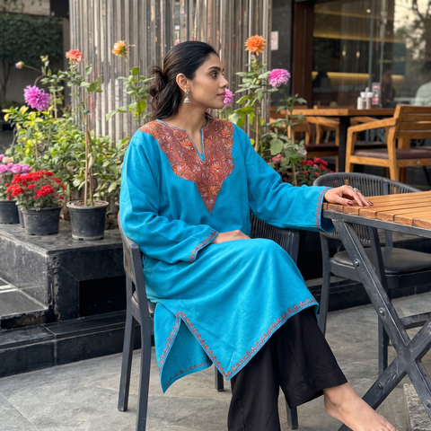 Blue Sozni Hand Embroidered Kashmiri Merino Wool Pheran, worn by a model, AI visual of the pheran, iTokri
