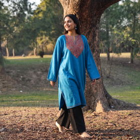 Blue Sozni Hand Embroidered Kashmiri Merino Wool Pheran, worn by a model, AI visual of the pheran, iTokri