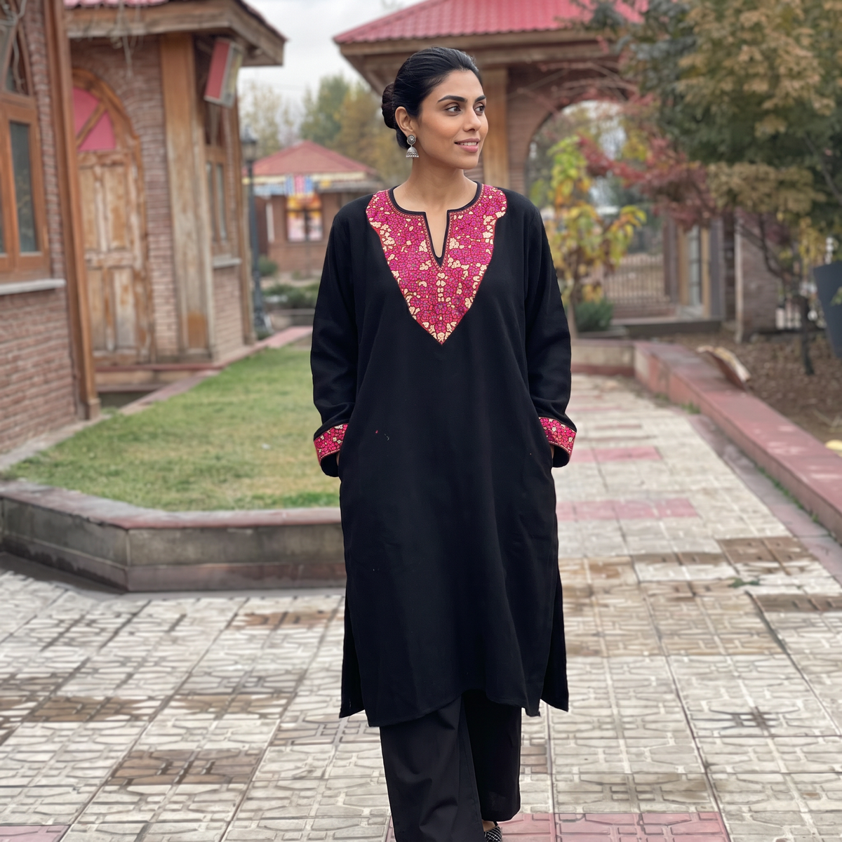 Black Sozni Hand Embroidered Kashmiri Merino Wool Pheran, worn by a model, AI visual of the pheran, iTokri