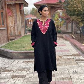 Black Sozni Hand Embroidered Kashmiri Merino Wool Pheran, worn by a model, AI visual of the pheran, iTokri