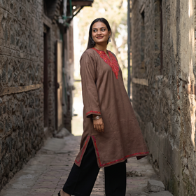 Brown Sozni Hand Embroidered Kashmiri Merino Wool Pheran, worn by a model, AI visual of the pheran, iTokri