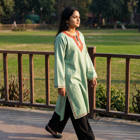 Green Sozni Hand Embroidered Kashmiri Merino Wool Pheran, worn by a model, AI visual of the pheran, iTokri