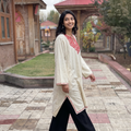 White Sozni Hand Embroidered Kashmiri Merino Wool Pheran, worn by a model, AI visual of the pheran, iTokri