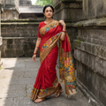 Red Srikalahasti Handloom Mangalagiri Pattu Silk Handpainted Pen Kalamkari Saree with Zari Border, draped and worn by a woman, AI visual of the saree, iTokri