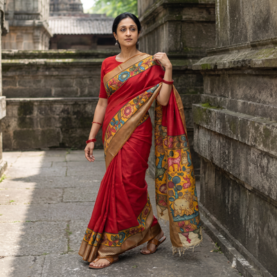 Red Srikalahasti Handloom Mangalagiri Pattu Silk Handpainted Pen Kalamkari Saree with Zari Border, draped and worn by a woman, AI visual of the saree, iTokri