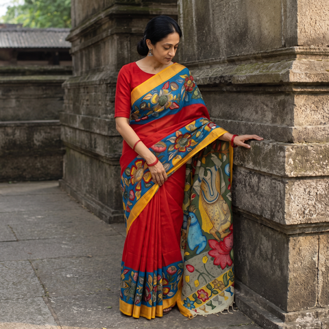 Red Srikalahasti Handloom Mangalagiri Silk Handpainted Pen Kalamkari Saree with Zari Border, draped and worn by a woman, AI visual of the saree, iTokri