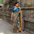 Blue Srikalahasti Handpainted Natural Dyed Bangalore Silk Zari Border Pen Kalamkari Saree, draped and worn by a woman, AI visual of the saree, iTokri