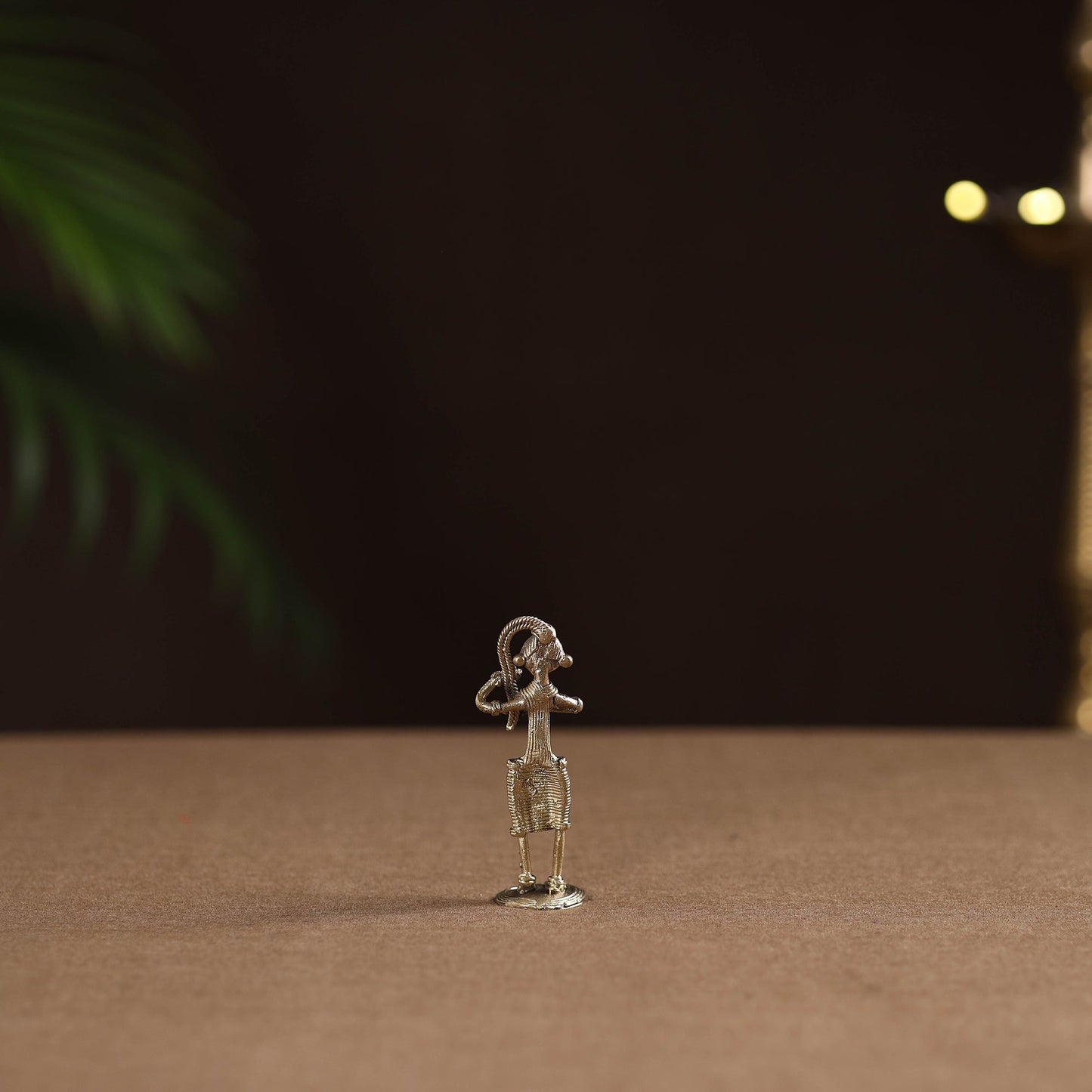 Standing lady with braising her hair tribal odisha dokra