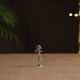 Standing lady with braising her hair tribal odisha dokra