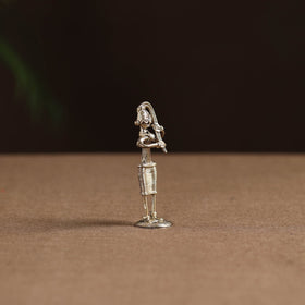 Standing lady with braising her hair tribal odisha dokra