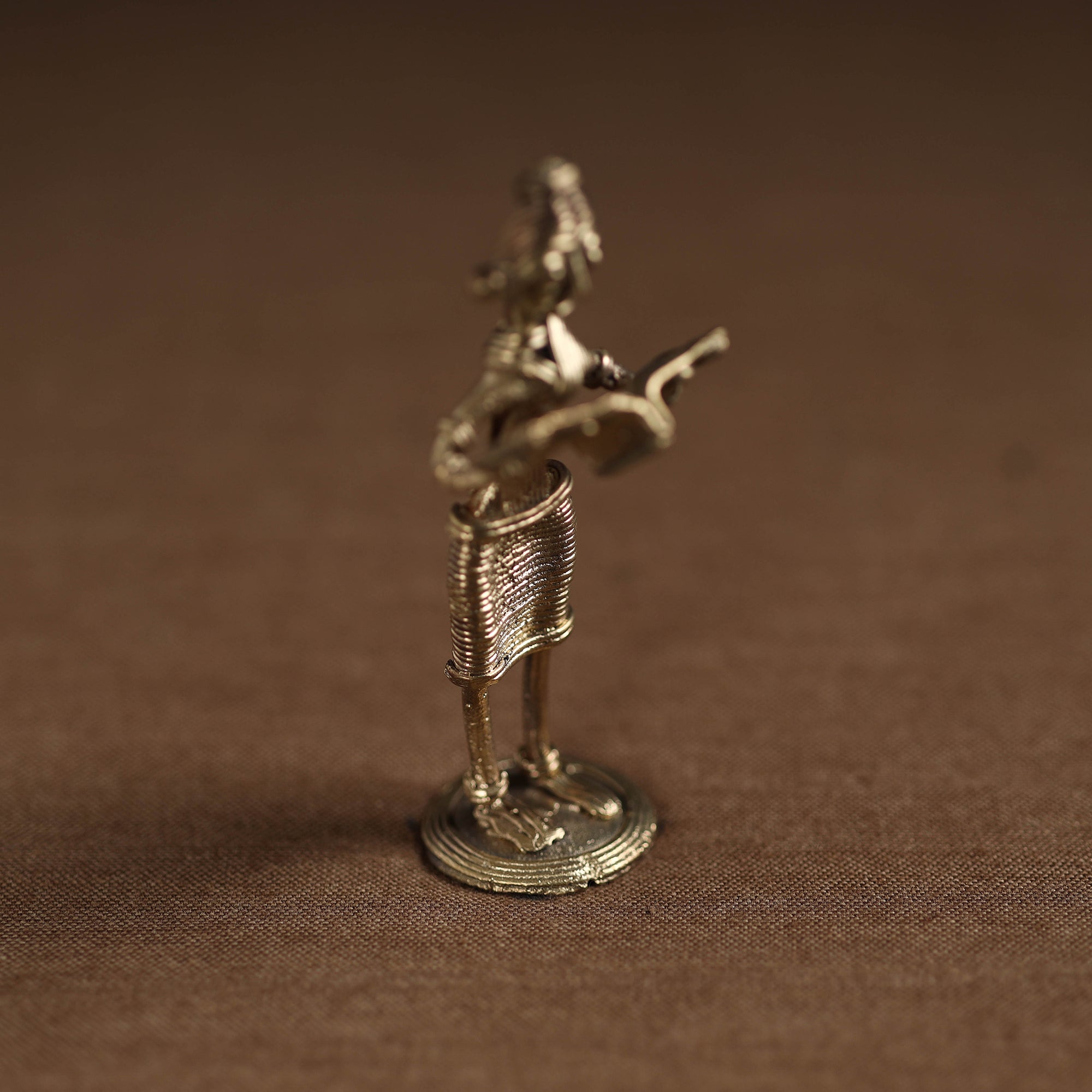 Standing lady with reading book tribal odisha dokra art