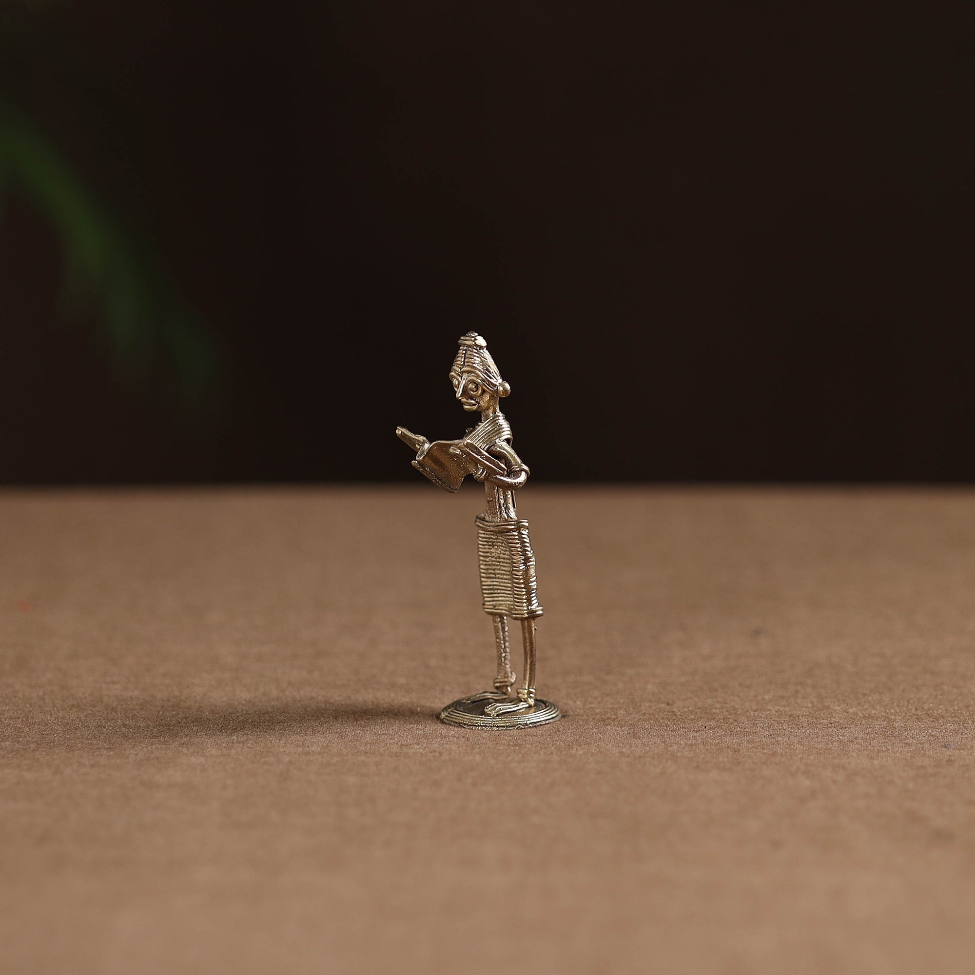 Standing lady with reading book tribal odisha dokra art