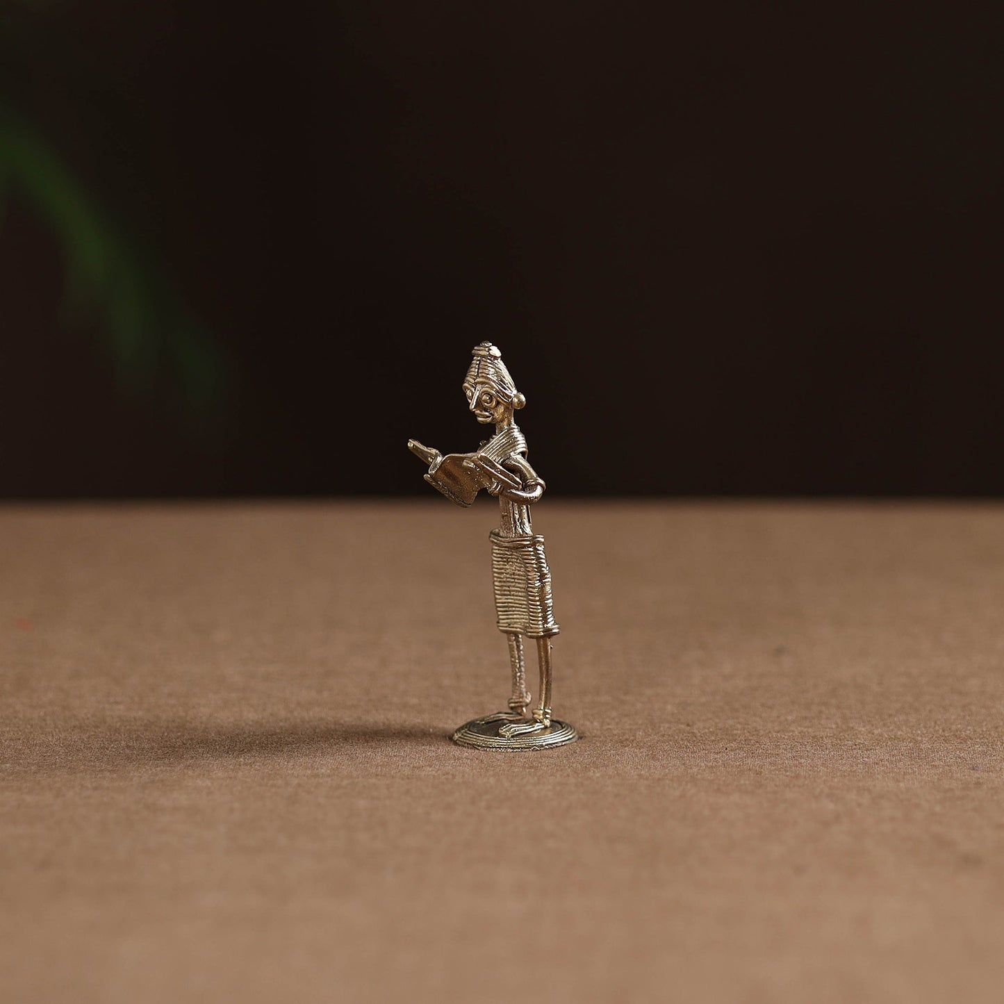 Standing lady with reading book tribal odisha dokra art