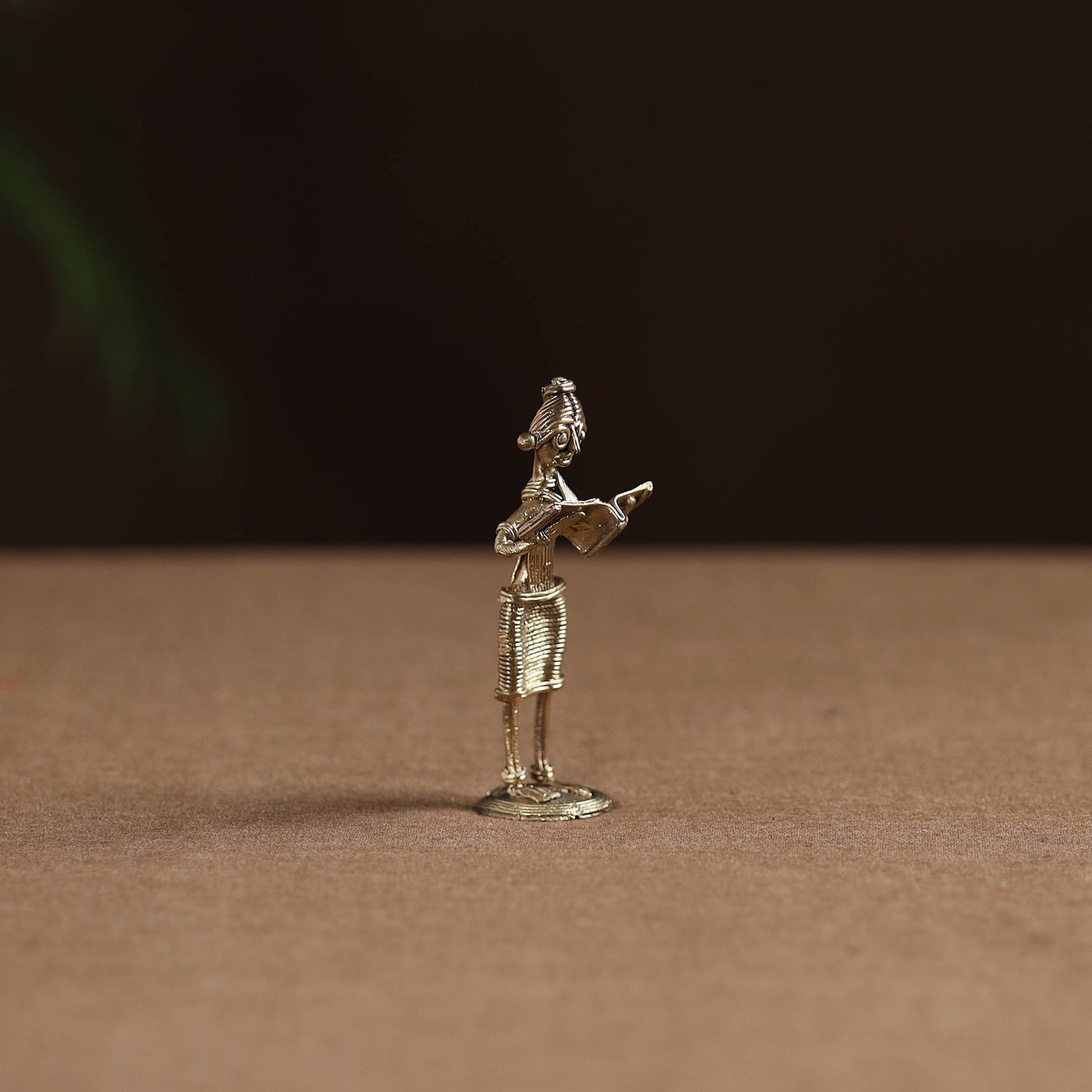 Standing lady with reading book tribal odisha dokra art