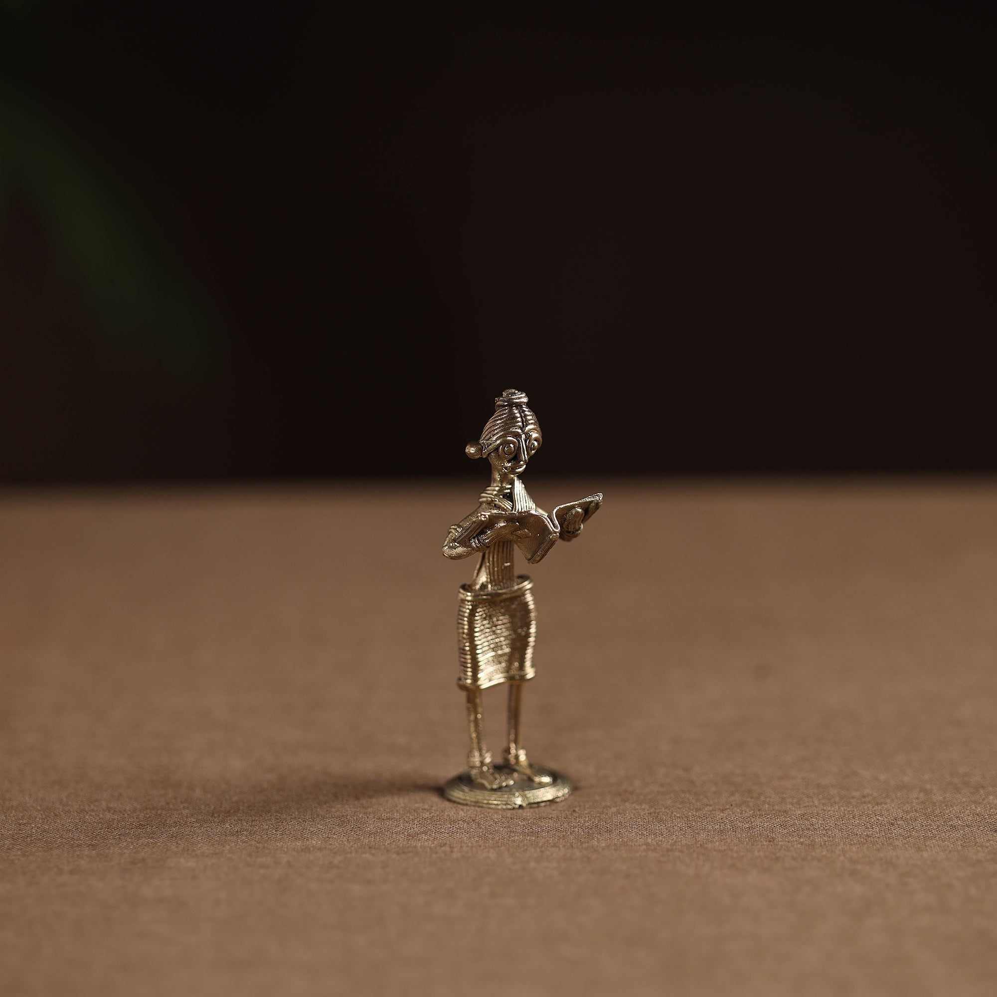 Standing lady with reading book tribal odisha dokra art