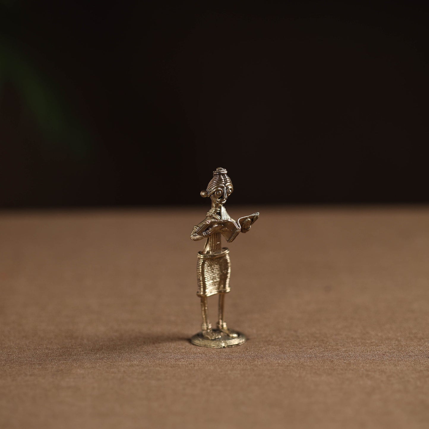 Standing lady with reading book tribal odisha dokra art