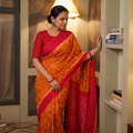 Orange Telia Rumal Handloom Cotton Pochampally Double Ikat Saree, draped and worn by a woman, AI visual of the saree, iTokri
