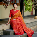 Orange Telia Rumal Handloom Cotton Pochampally Double Ikat Saree, draped and worn by a woman, AI visual of the saree, iTokri