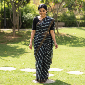 Black Tie-Dye Chanderi Silk Leheriya Saree with Zari Border, draped and worn by a woman, AI visual of the saree, iTokri