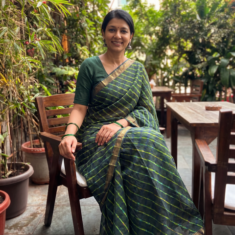 Dark Green Tie-Dye Chanderi Silk Leheriya Saree with Zari Border, draped and worn by a woman, AI visual of the saree, iTokri