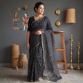 Black Tie-Dye Kota Doria Cotton Leheriya Saree, draped and worn by a woman, AI visual of the saree, iTokri
