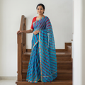 Blue Tie-Dye Kota Doria Silk Leheriya Saree with Zari Border, draped and worn by a woman, AI visual of the saree, iTokri