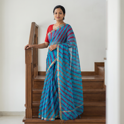 Blue Tie-Dye Kota Doria Silk Leheriya Saree with Zari Border, draped and worn by a woman, AI visual of the saree, iTokri