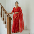 Red Tie-Dye Mothra Chanderi Silk Leheriya Saree with Zari Border, draped and worn by a woman, AI visual of the saree, iTokri