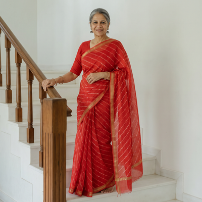 Red Tie-Dye Mothra Chanderi Silk Leheriya Saree with Zari Border, draped and worn by a woman, AI visual of the saree, iTokri