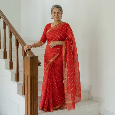 Red Tie-Dye Mothra Chanderi Silk Leheriya Saree with Zari Border, draped and worn by a woman, AI visual of the saree, iTokri