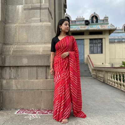 Red Tie-Dye Mulberry Silk Handloom Leheriya Saree, draped and worn by a woman, AI visual of the saree, iTokri