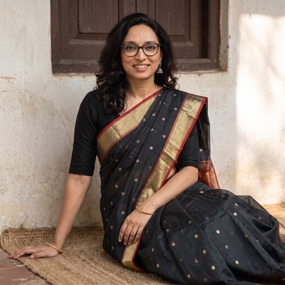 Black Traditional Buta Handloom Zari Work Chanderi Silk Saree, draped and worn by a woman, AI visual of the saree, iTokri