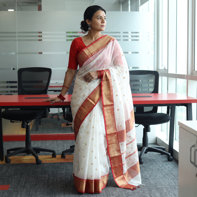 White Traditional Chanderi Silk Handloom Zari Buti Saree with Zari Border, draped and worn by a woman, AI visual of the saree, iTokri