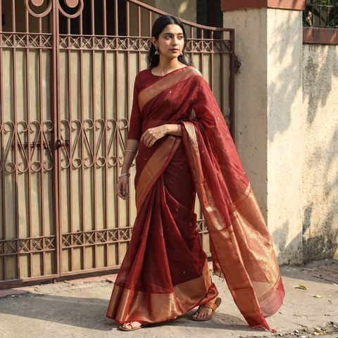 Maroon Traditional Chanderi Silk Tissue Zari Weave Handloom Saree with Nakshi Zari Border & Buti, draped and worn by a woman, AI visual of the saree, iTokri