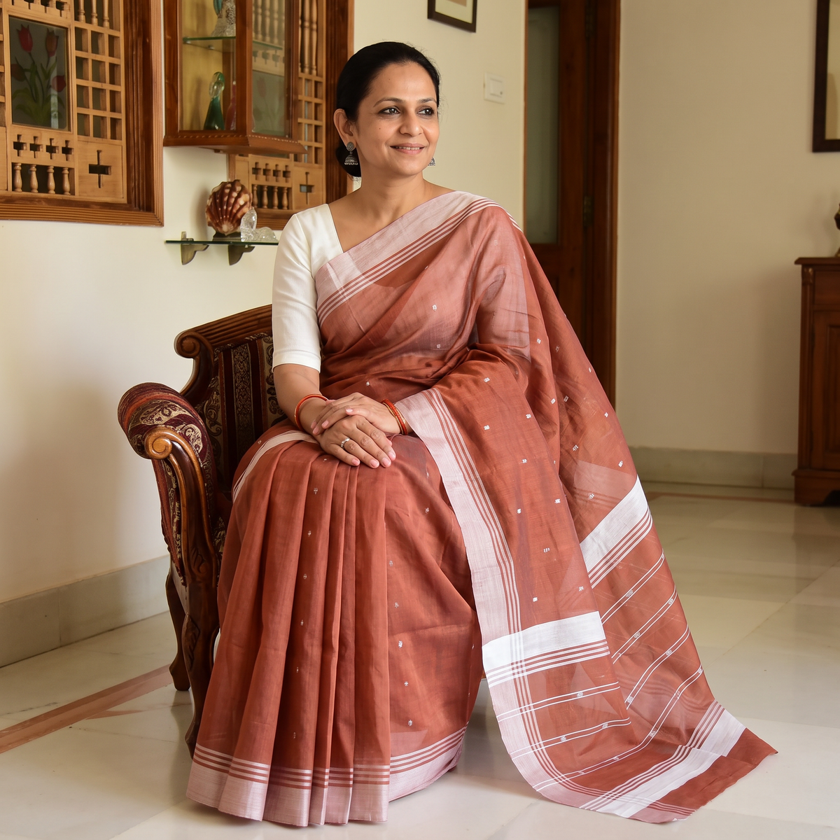 Brown Traditional Handloom Buti Chanderi Silk Saree, draped and worn by a woman, AI visual of the saree, iTokri