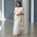 White Traditional Handloom Maheshwari Silk Saree, draped and worn by a woman, AI visual of the saree, iTokri