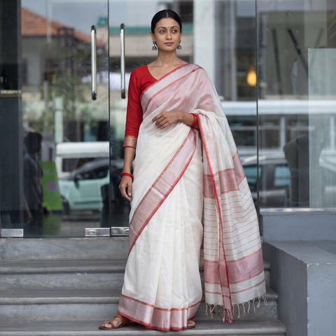 White Traditional Handloom Maheshwari Silk Saree, draped and worn by a woman, AI visual of the saree, iTokri