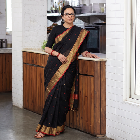 Black Traditional Handloom Triangle Buti Silk Maheshwari Saree, draped and worn by a woman, AI visual of the saree, iTokri