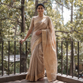 Brown Traditional Handloom Zari Work Silk Maheshwari Saree, draped and worn by a woman, AI visual of the saree, iTokri