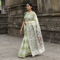 Green Traditional Madhubani Handpainted Chanderi Silk Saree, draped and worn by a woman, AI visual of the saree, iTokri