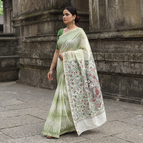 Green Traditional Madhubani Handpainted Chanderi Silk Saree, draped and worn by a woman, AI visual of the saree, iTokri