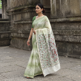 Green Traditional Madhubani Handpainted Chanderi Silk Saree, draped and worn by a woman, AI visual of the saree, iTokri