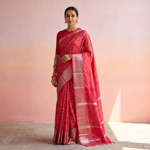 Pink Traditional Pochampally Ikat Handwoven Pure Silk Pattu Saree with Rudraksha Border, draped and worn by a woman, AI visual of the saree, iTokri