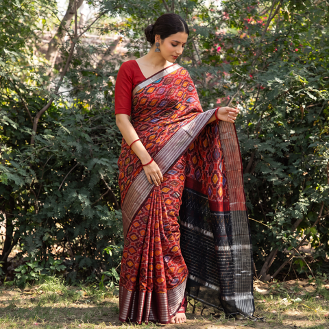 Red Traditional Pochampally Ikat Handwoven Pure Silk Pattu Saree with Rudraksha Border, draped and worn by a woman, AI visual of the saree, iTokri