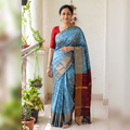 Blue Traditional Pochampally Ikat Handwoven Pure Silk Pattu Saree with Rudraksha Border, draped and worn by a woman, AI visual of the saree, iTokri